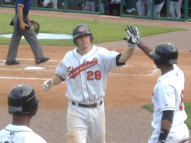 Tyler Kolodny (number 28) accepts kudos from teammate Rodolfo Cardona as L.J. Hoes looks on after crushing a home run during the June 19th game against Hagerstown.