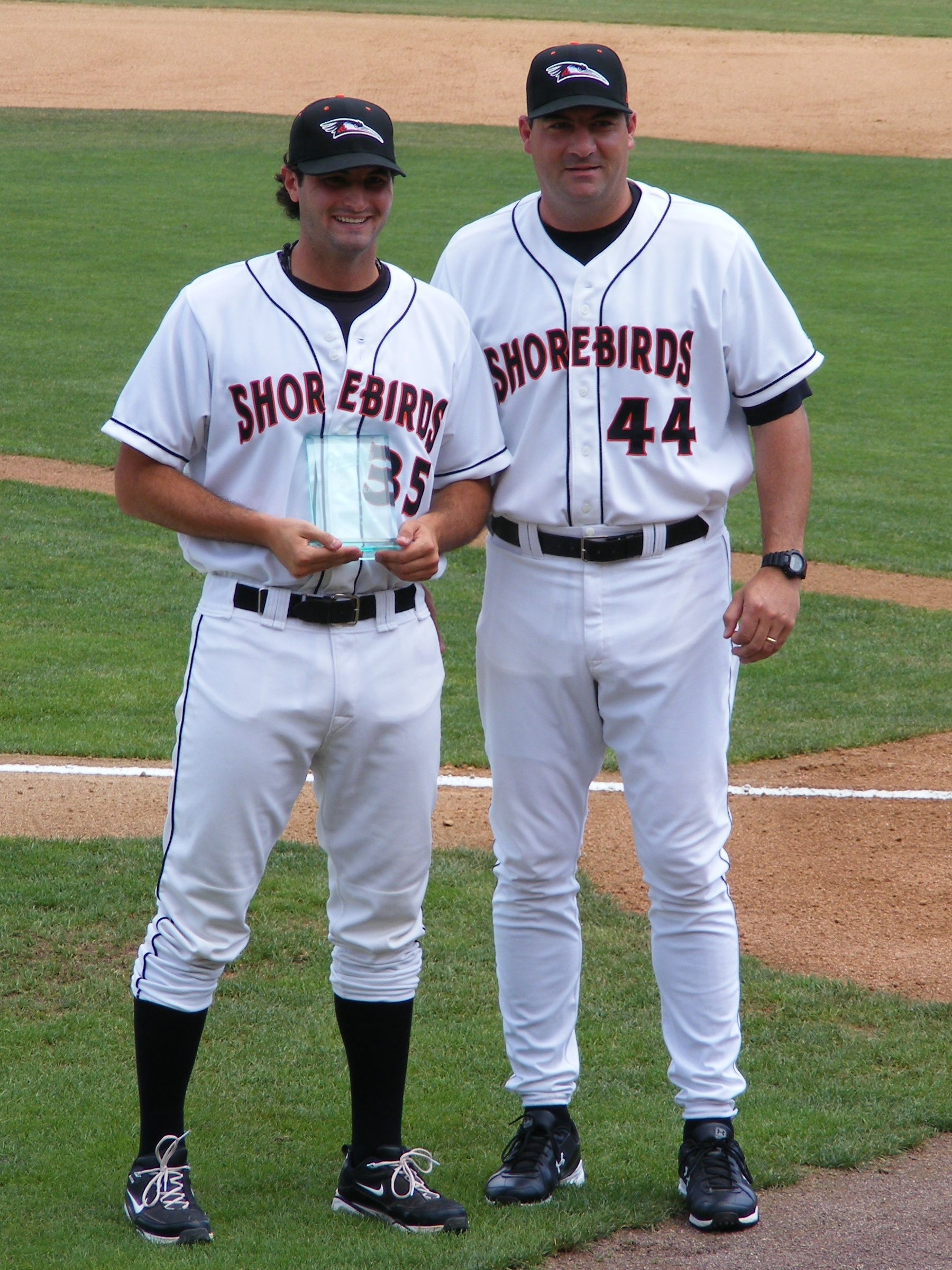 An enjoyable part of Ryan Minor's job is to hand out various organization awards. Here Minor (right) presents the Orioles Pitcher of the Month award to Shorebird hurler Nathan Moreau.