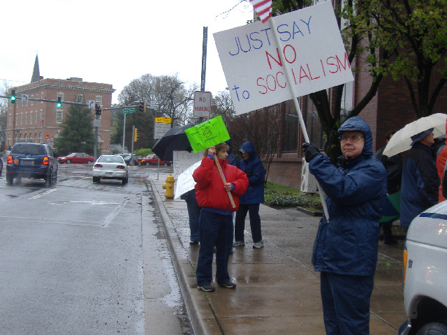 Some of the protestors lined up along Division Street for passing motorists' reactions.
